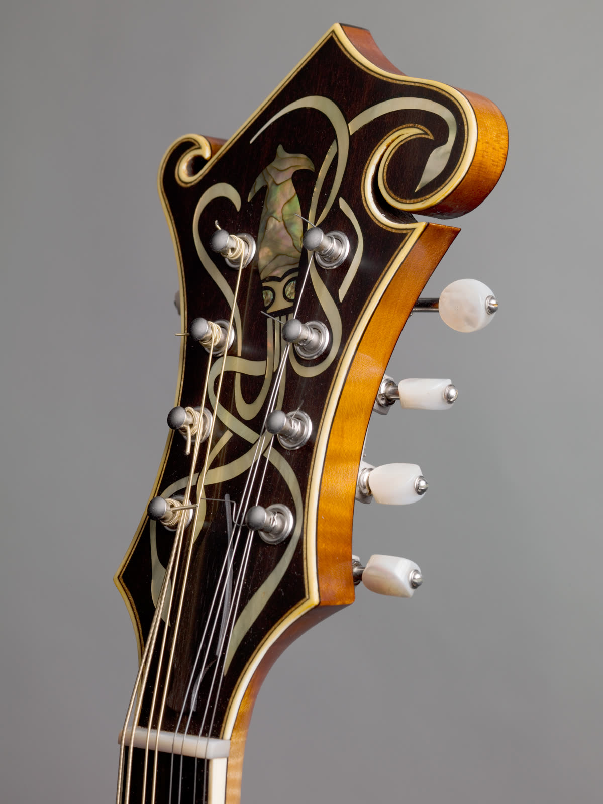 F-model mandolin, peghead, ebony, pearl, abalone, ivoroid