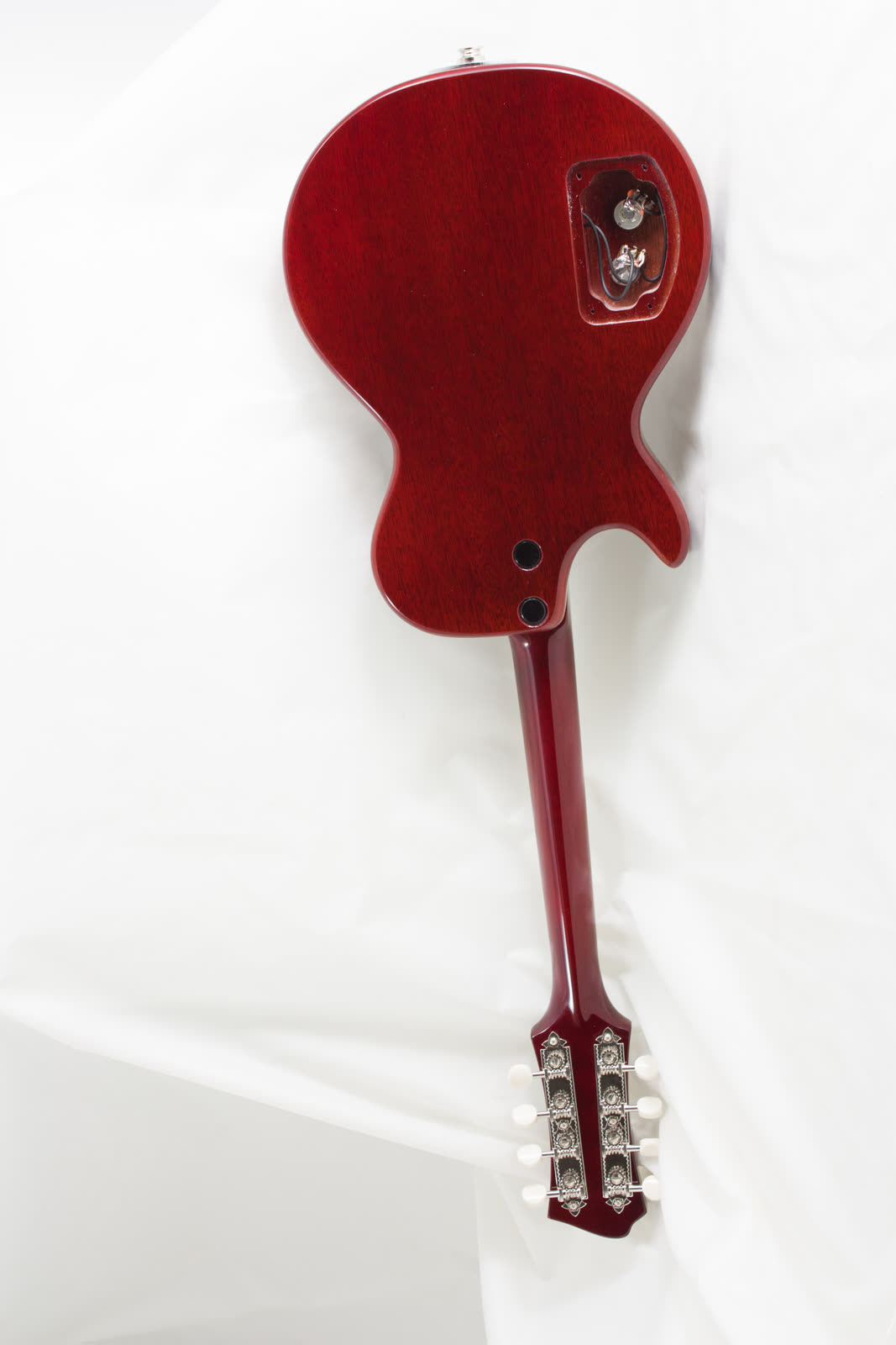 Electric mandolin — control cavity, exposed pots and wiring, red lacquer back